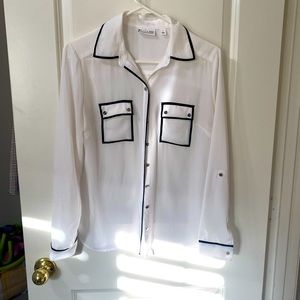 White sheer blouse with black trim pockets, sleeves & collar.